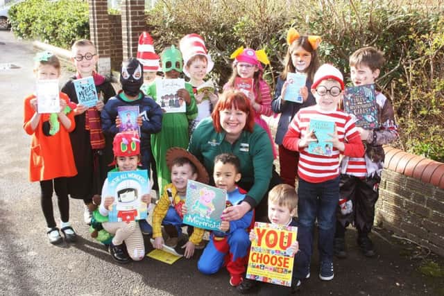 DM1930554a.jpg. World Book Day at Lyndhurst Infant School, Worthing. Nikki Storer, community champion and children with books for their school library, donated by Morrisons Worthing. Photo by Derek Martin Photography