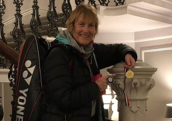 Cathy Bargh proudly displays the two medals she won in York