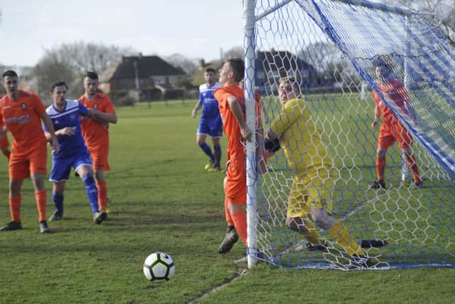 Action from the top-of-the-table clash between Sidley United and Battle Baptists