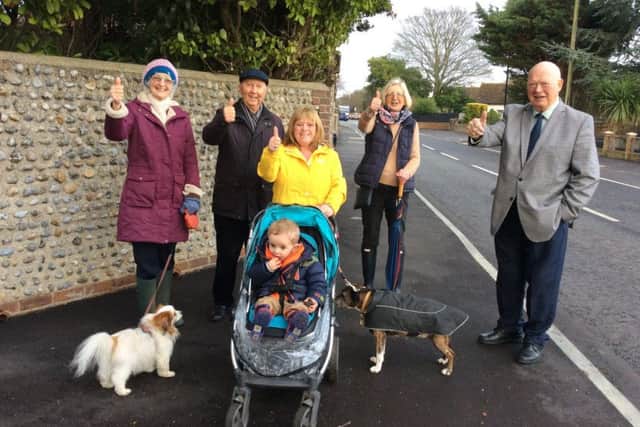 Councillor George Barton, councillor Carol Albury, chairman of the neighbourhood panel Ken Carr, and residents Virginia Kemp with Tuppany, Nicky Prior with grandson Ledley and Kie the dog