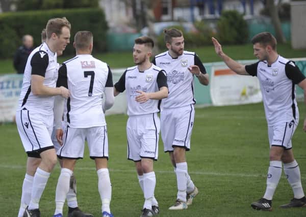 Bexhill United celebrate their opening goal in the 2-1 win at home to Oakwood. Picture by Simon Newstead