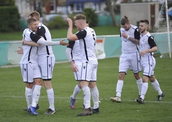 Bexhill United celebrate their opening goal in the 2-1 win at home to Oakwood