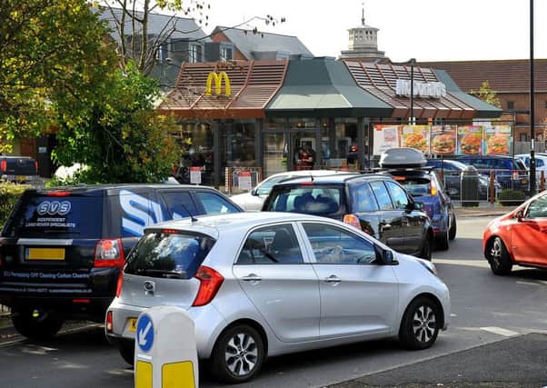 Traffic queueing to enter McDonald's drive thru Burgess Hill is causing problems on the roundabout just outside. Pic Steve Robards SR1829128 SUS-180311-162546001