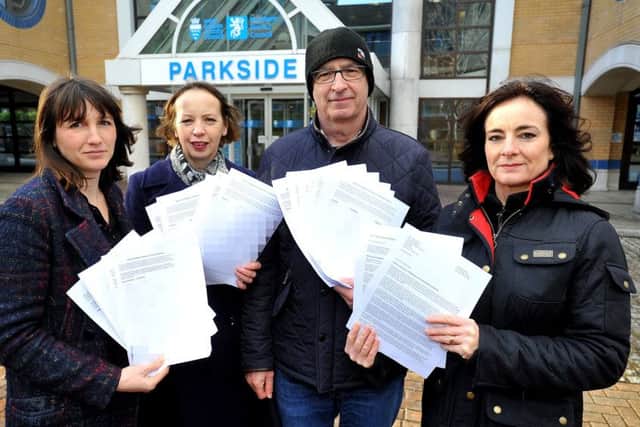 Lucy Holloway, who started the petition with two other mums, pictured with Labour members Carol Hayton,  Michael and Karen Symes outside council offices with the petition, which called for weekly food waste collections