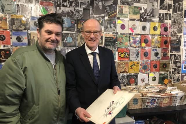 Chris Collins and Nick Gibb in the retro and vinyl record shop that helps to support Radio Respect