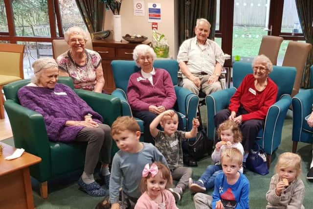 Residents of Abbotswood Extra Care Housing in Rustington with their new friends from The Playcentre