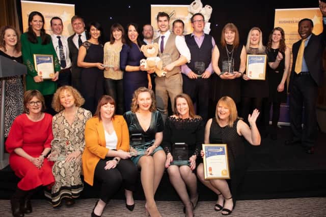 Chestnut Tree House Business Awards 2019 winners on stage with hosts Allison Ferns and Ambrose Harcourt, Chestnut Tree House vice-president