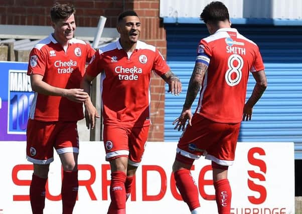 Crawley Town's Karlan-Ahearne Grant is congratulated by team-mates Josh Doherty and Jimmy Smith after taking the lead for Reds during their 1-1 draw at Mansfield Town with his seventh-minute goal.
Picture by Andrew Roe