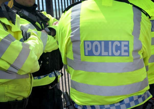 Three men have been charged by police in connection with a rape on a Sussex town's seafront