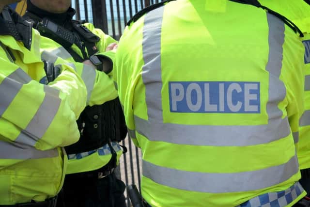 Three men have been charged by police in connection with a rape on a Sussex town's seafront