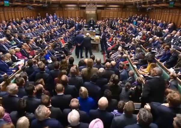 MPs wait to hear the result of a vote on Theresa May's latest Brexit deal (photo from Parliament.tv).