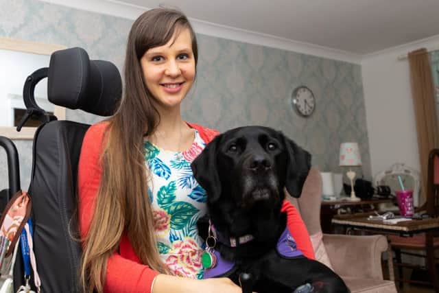 Sally Whitney with her assistance dog Ethan. Picture: Paul Davey / SWNS