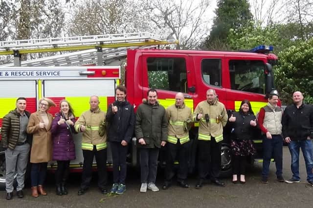Some of the Holyrood residents outside the fire engine