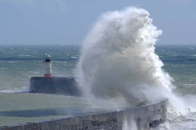 Huge waves at Newhaven. Photo by Jessie Cripps SUS-190313-105848008