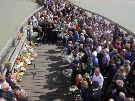 A memorial service held to remember the 11 men that died in the Shoreham Airshow crash