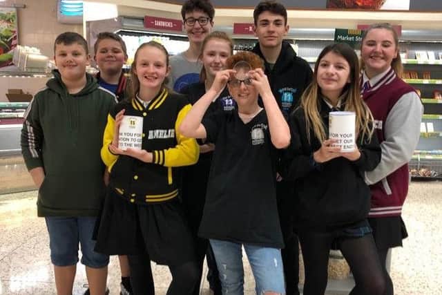Some of the cast of 13 The Musical at Morrisons Littlehampton, where they raised money through bag packing