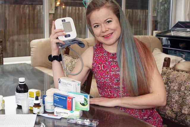 Kirsty with the medication she has to take following her transplant