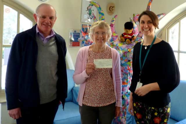 Tricia Hall and David Bettiss presenting the cheque to Chestnut Tree House