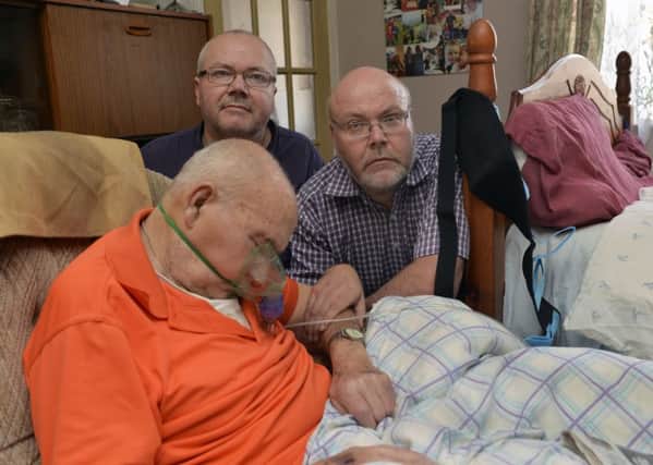 Steven and Paul Neilson with their Dad Sydney, 86, who they have been caring for at his home in Eastbourne (Photo by Jon Rigby)