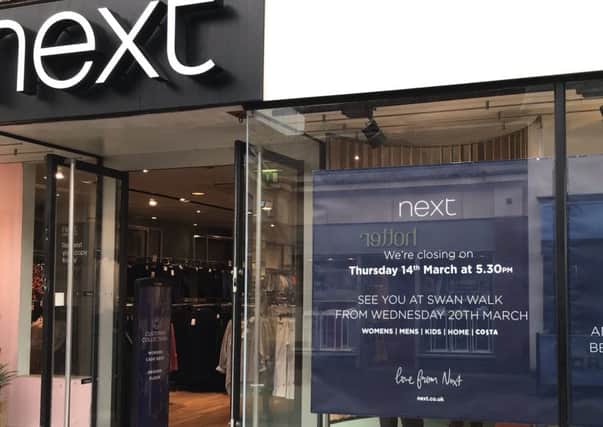 Signs confirm the closure of the Next store in West Street