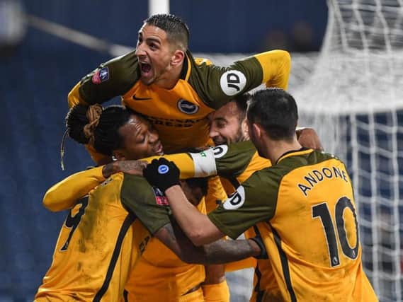Albion celebrate after a Glenn Murray goal in the fourth round replay win at West Brom. Picture by PW Sporting Photography