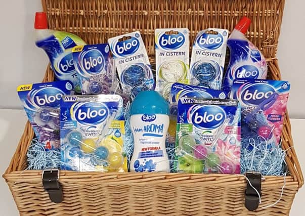 A hamper full of Bloo cleaning products