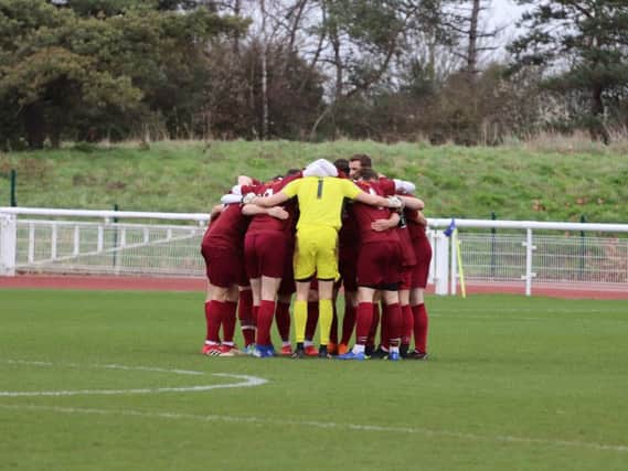 The Bognor huddle at Enfield - now the squad have been hit by more injuries / Picture by Little James Photography.