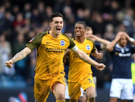 Lewis Dunk celebrates Brighton's penalty shoot-out win at Millwall. Picture by Mike Hewitt / Getty Images