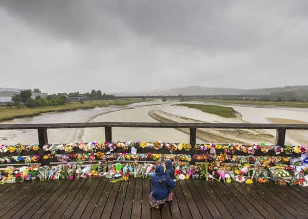 Floral tributes left on the Old Toll Bridge in Shoreham, after the Shoreham air crash  (Photograph: Eddie Mitchell)