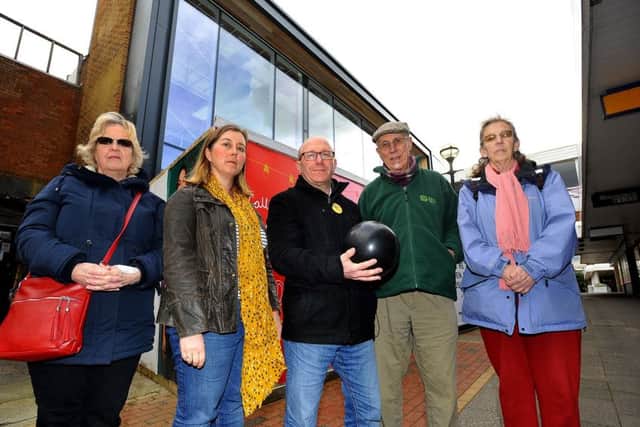 Temporary library site in Burgess Hill town centre. Robert Eggleston,with fellow Lib Dems with a bowling ball looking forward to the new bowling facility but concerned about the long term future of the library. 18/03/19 Pic Steve Robards SR1907372 SUS-190318-160151001