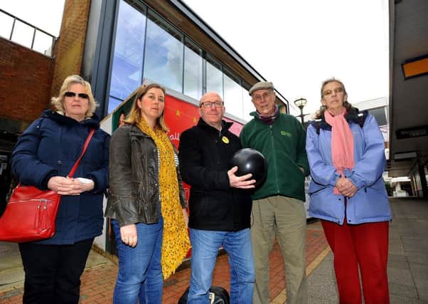 Temporary library site in Burgess Hill town centre. Robert Eggleston,with fellow Lib Dems with a bowling ball looking forward to the new bowling facility but concerned about the long term future of the library. 18/03/19 Pic Steve Robards SR1907372 SUS-190318-160151001