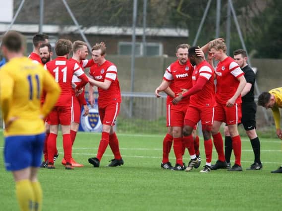 Horsham YMCA celebrate Jack Ryder's goal in their 4-2 away win over Lancing in the Premier Division on Saturday. All pictures by Derek Martin Photography.
