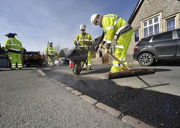 A highways crew fixing potholes in East Sussex