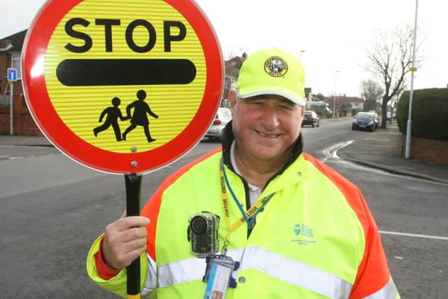Worthing lollipop man Terry Rickards with his body worn camera