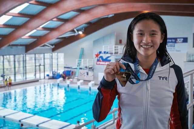 European Champion Eden Cheng helped coach children in the diving lessons