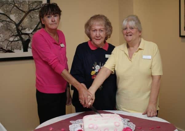 Anita Myddleton, Clare Mowatt cand Jenny Shaldon are celebrating a combined 80 years' of service at Red Oaks Care Home in Henfield SUS-190320-102801001