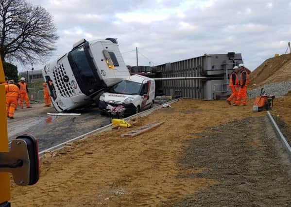 A lorry has toppled over on the Queensway Gateway road