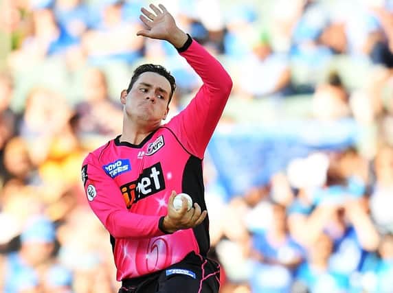 Ben Manenti of the Sixers bowls during the Big Bash League match between the Adelaide Strikers and the Sydney Sixers. (Photo by Daniel Kalisz/Getty Images)
