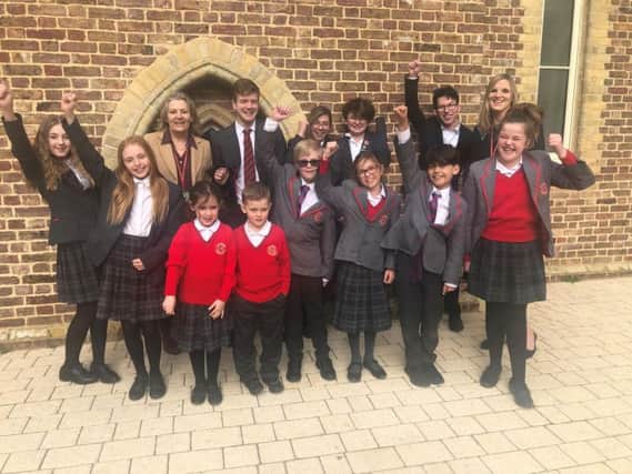Chichester Free School children celebrate with interim principal, Jenny Clough (left) and newly appointed principal, Louise New, after the school retained its good Ofsted rating. Picture contributed