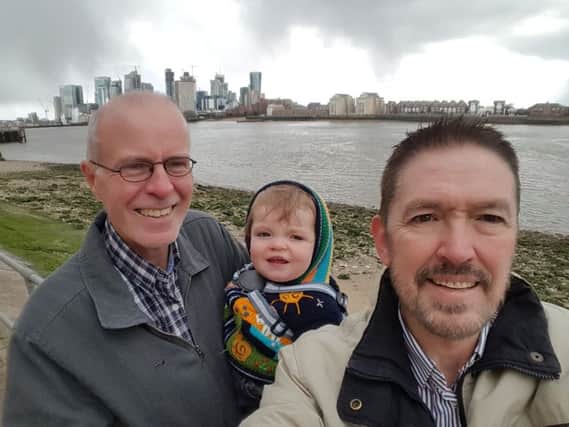 Richard (right) with his partner Andrew and their son James