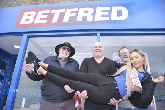 Lois with Betfred customers Dave Ackers, Trevor Brown and Peter Miller SUS-190320-172709001