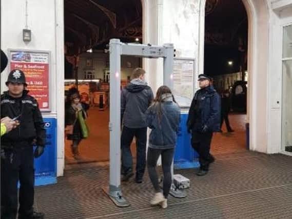 Police at Brighton railway station with the metal detector. Picture via Brighton and Hove Police
