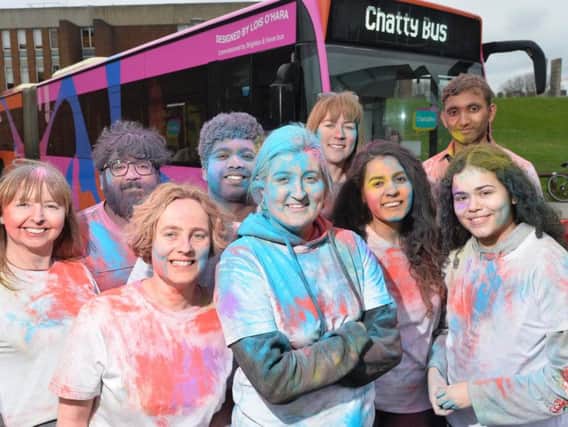 Brighton & Hove Buses' staff, Impetus volunteers and artist Lois O'Hara (centre)