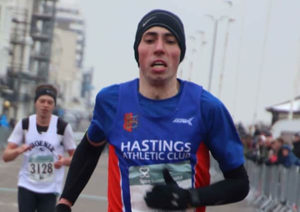 Gary Foster crosses the line to finish third in last year's Hastings Half Marathon. Picture courtesy Roberts Photographic