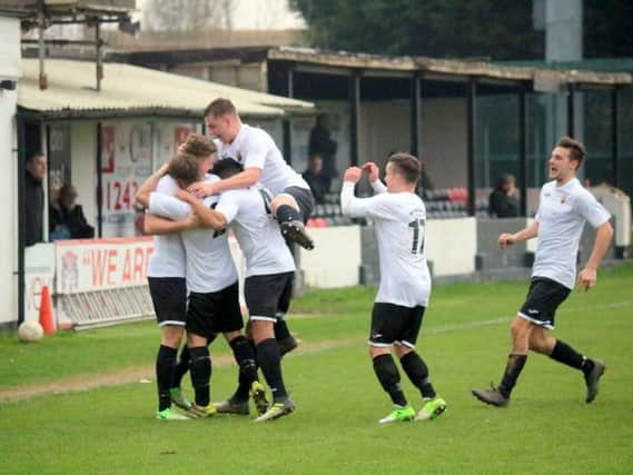 Pagham celebrate a goal - but they ended up on the losing side / Picture by Roger Smith