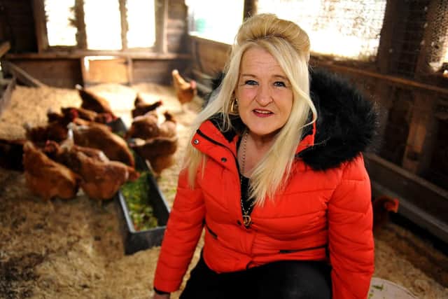 Old Gardens Animal Rescue Centre owner Irene Clarke with some of the chickens. Photo: Steve Robards. SR1907851