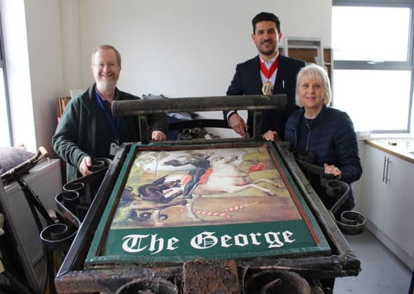 The Mayor of Crawley, Councillor Carlos Castro, was joined by Ron Goodall's daughter Diane West to present the sign to Crawley Museum