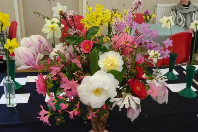 Vase of mixed spring flowers at Ninfield Horticultural Society Spring Show 2019 SUS-190326-093338001