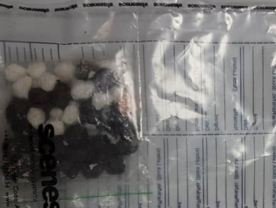 Police tweeted a picture of what appears to be wraps of drugs that were seized. Pictures: Sussex Police