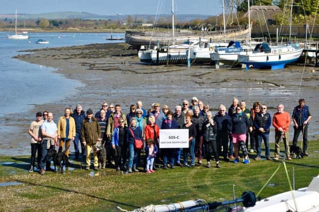 Libby Alexander from SOS-C, centre, with John Nelson, chairman of Chichester Harbour Trust, and concerned residents at Dell Quay